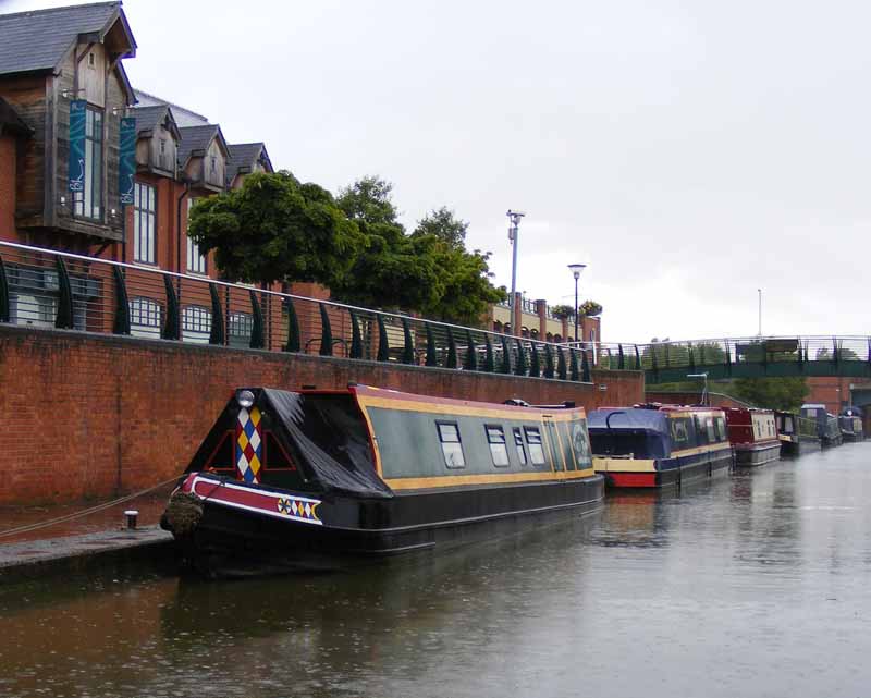 the houseboats are docked on the side of the water