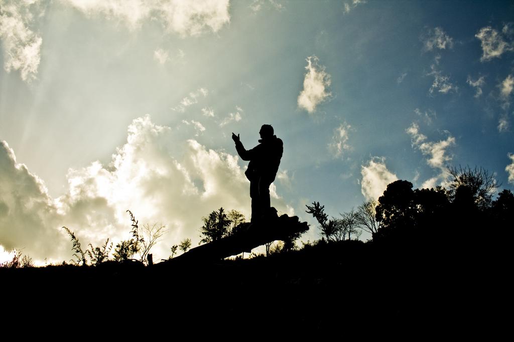 a person jumping in the air while holding his hand out