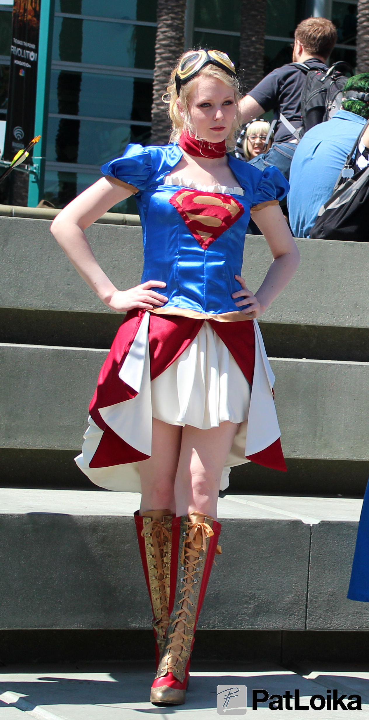 the woman is dressed up in a supergirl costume