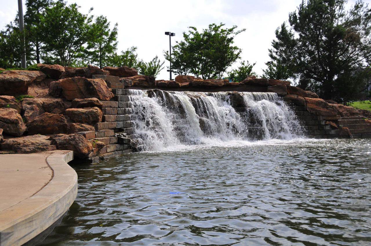 there is a large waterfall coming down from a small waterfall