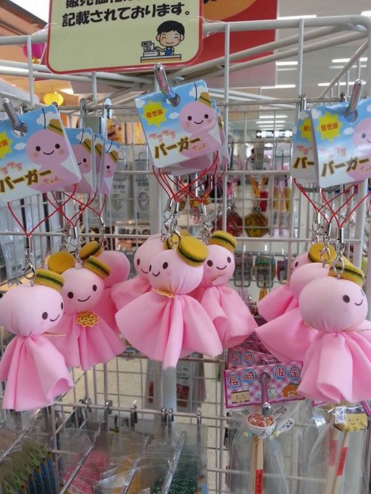 stuffed bears that are tied in a wire rack