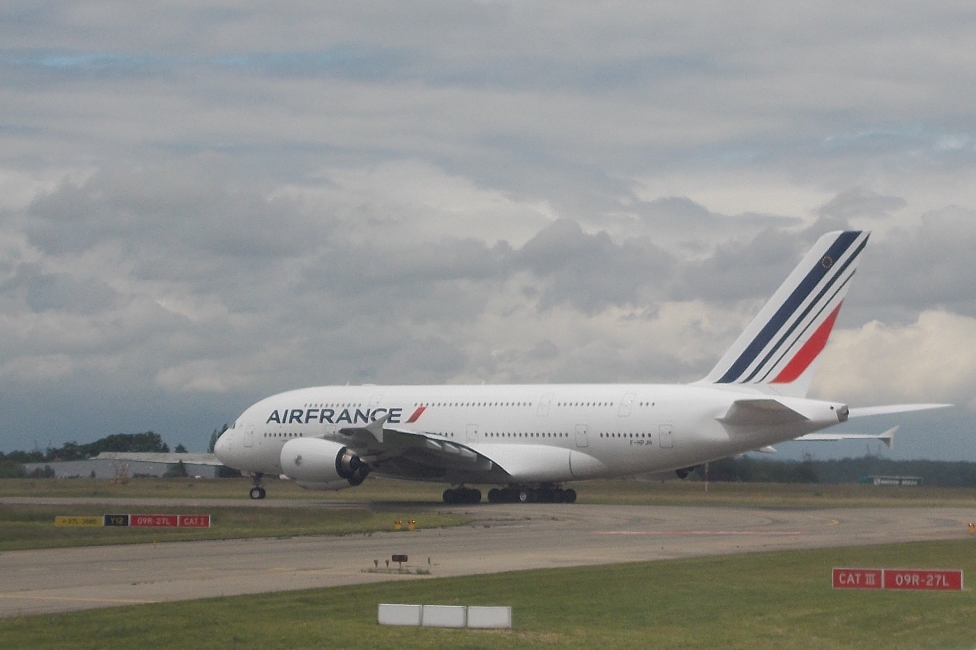 a large air plane that is sitting on a runway