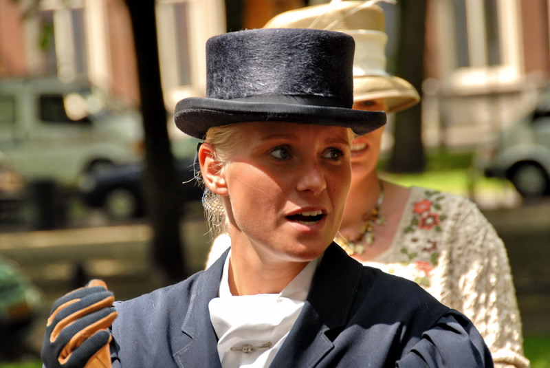 a woman is in costume on the street