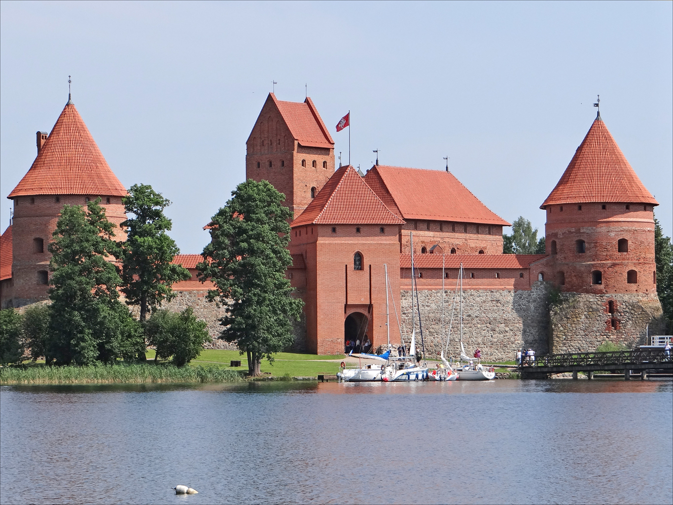 a castle sits on top of the water