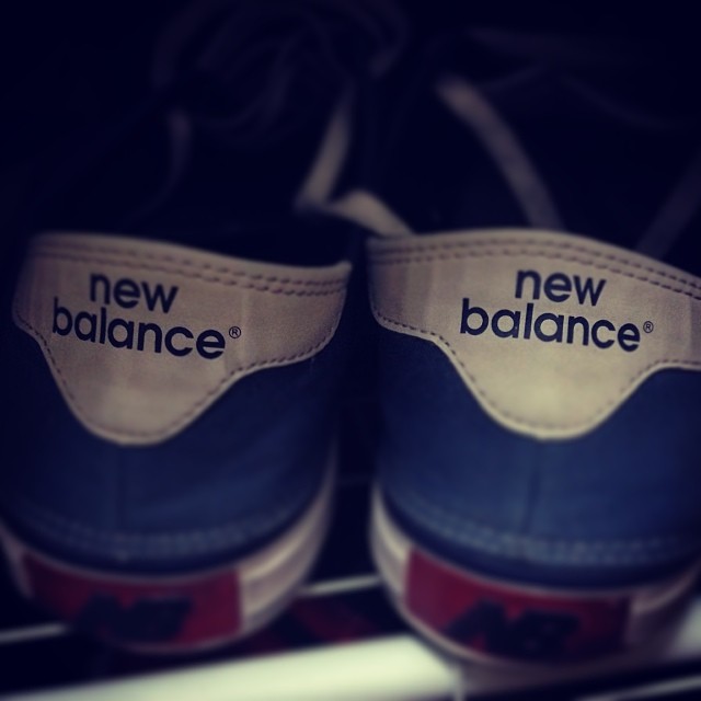 a close up of two new balance sneakers