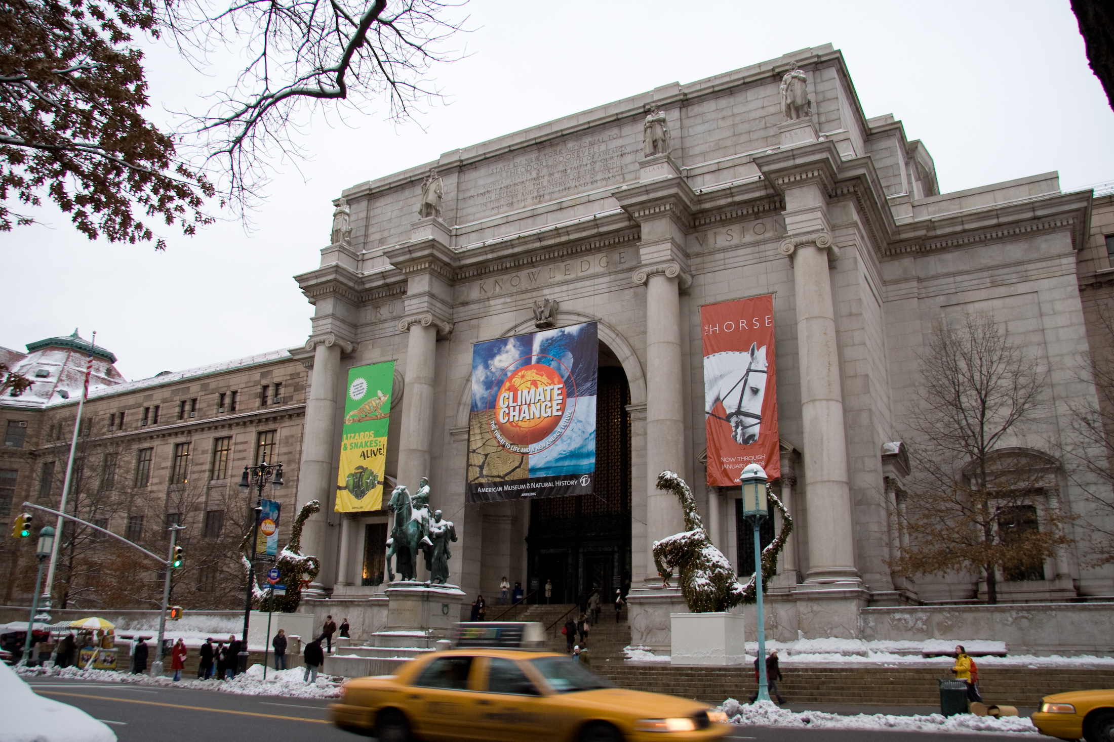 a big building with some posters on the side of it