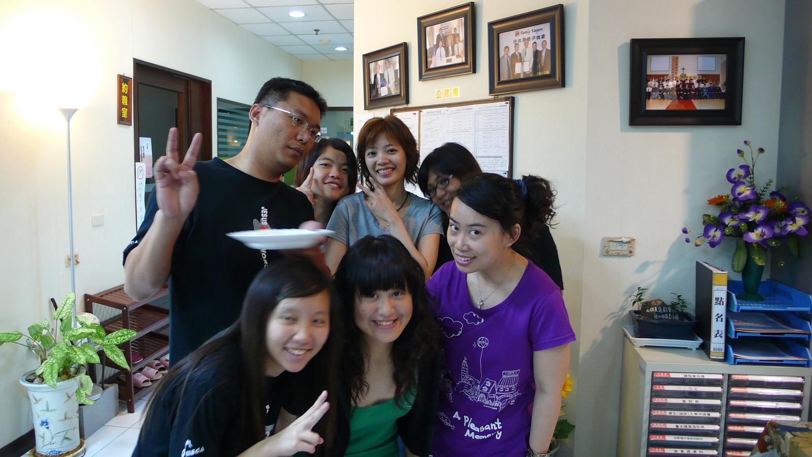 a group of people posing for a picture at a salon