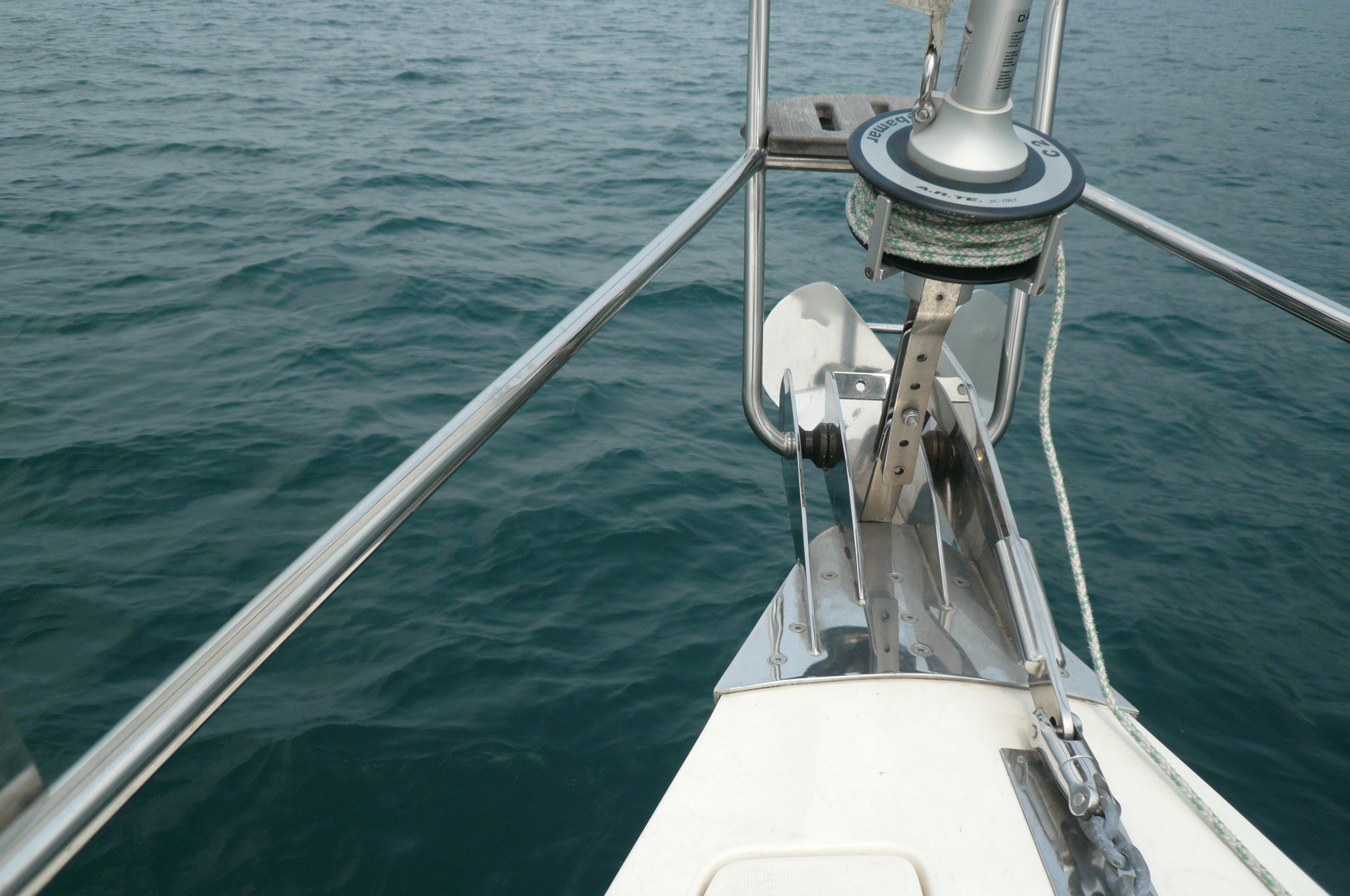 a boat's view from the front of a ship with waves in the background