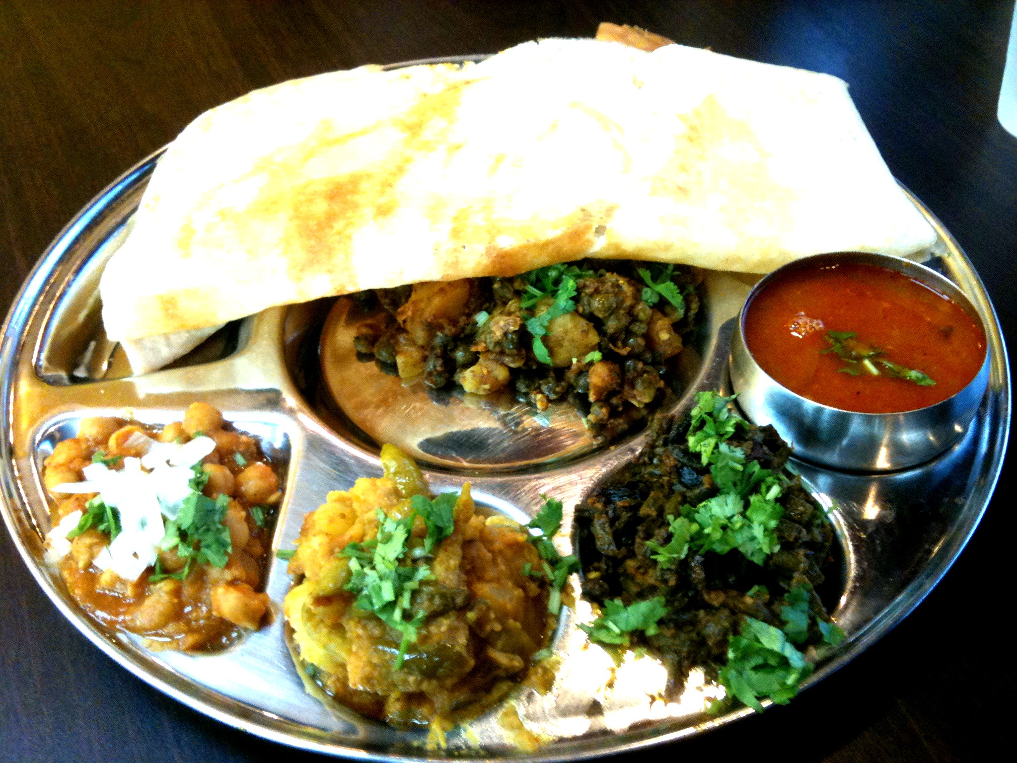 a plate is full of different indian food