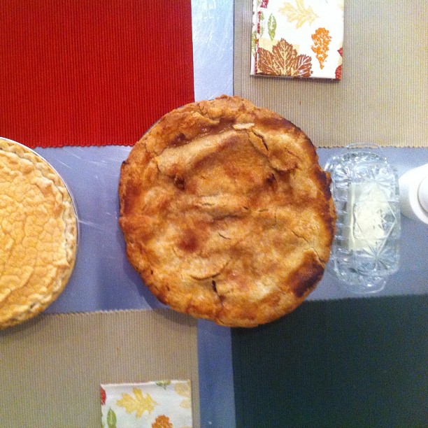 two different pies and two ice cream dishes
