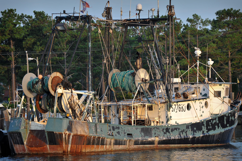 a large boat is docked at the pier