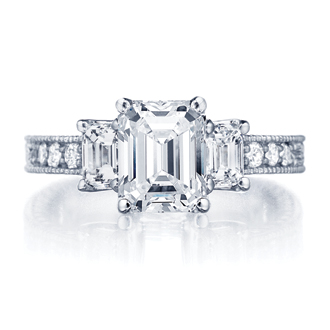 an emerald - cut engagement ring with pave cut diamonds