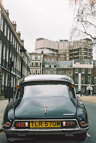 the rear of a car parked on a city street