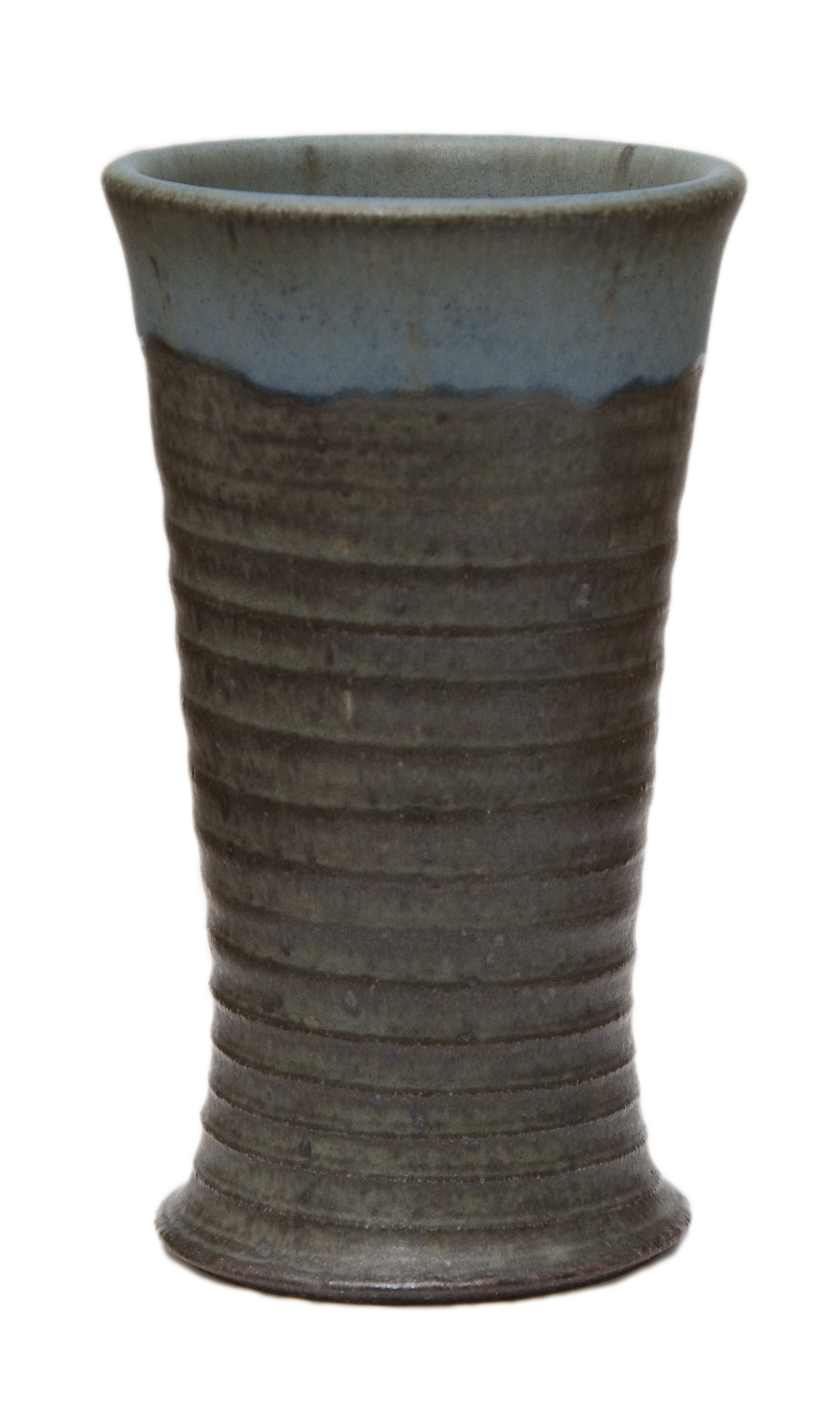 a small brown vase with blue swirl designs on it