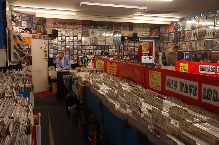 a room filled with record shops, dvds and cds