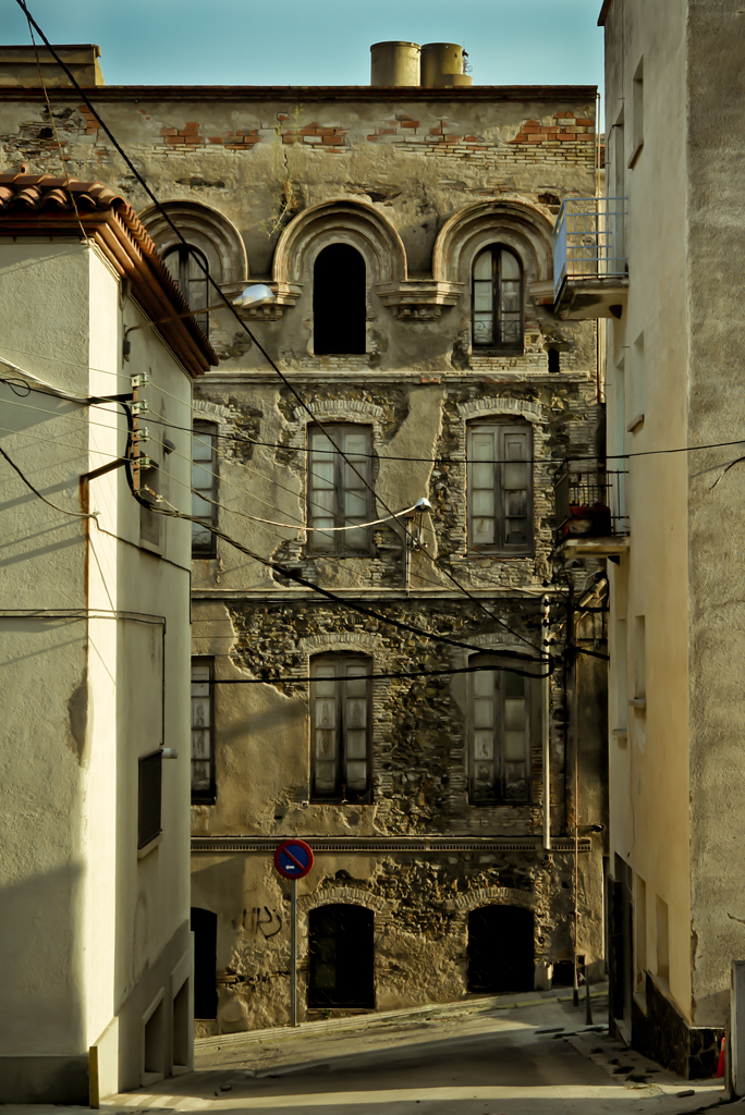 a tall building sitting next to a road