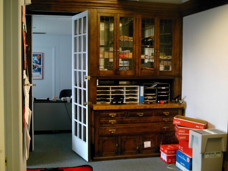a room with a large cabinet full of items