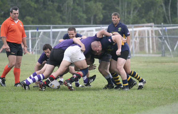 there are several men playing together in the field
