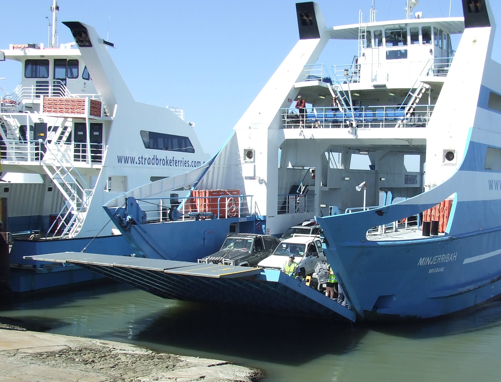 the boats are waiting to be loaded onto the ship