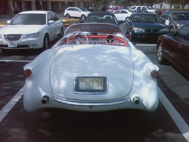 a white car parked in the parking lot