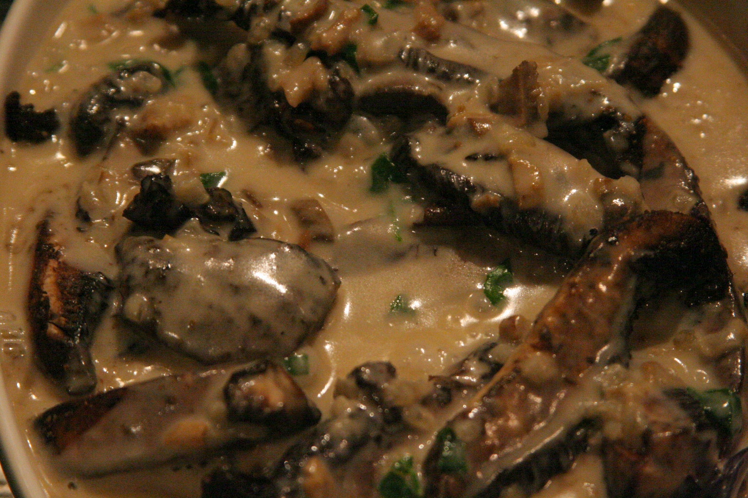 a close up of a bowl of food with spoons