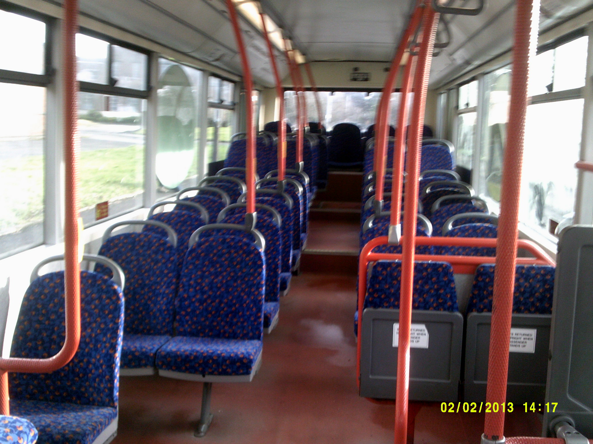 a bus with several seats that are open and empty