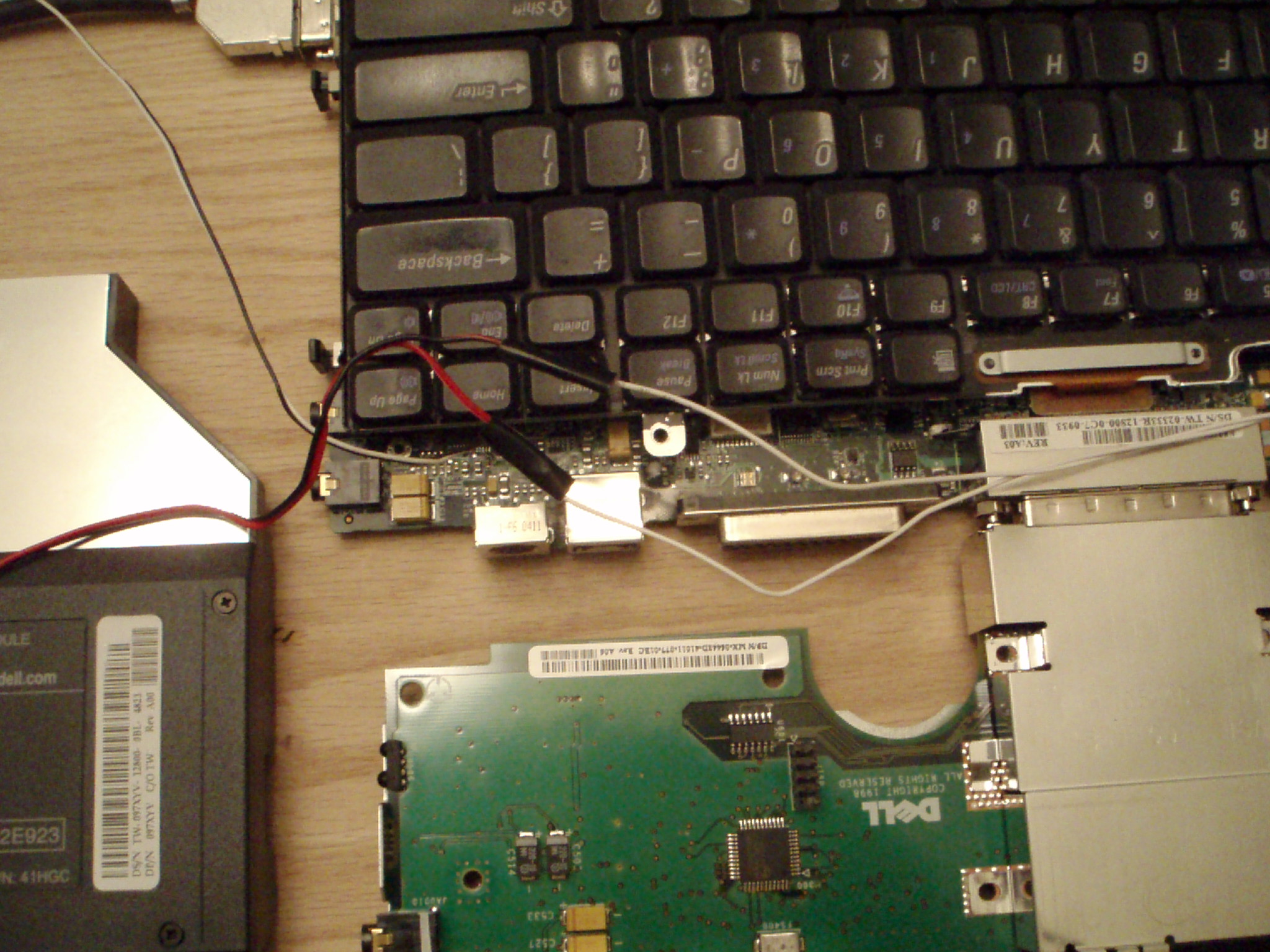 a laptop keyboard connected to the motherboard of a computer