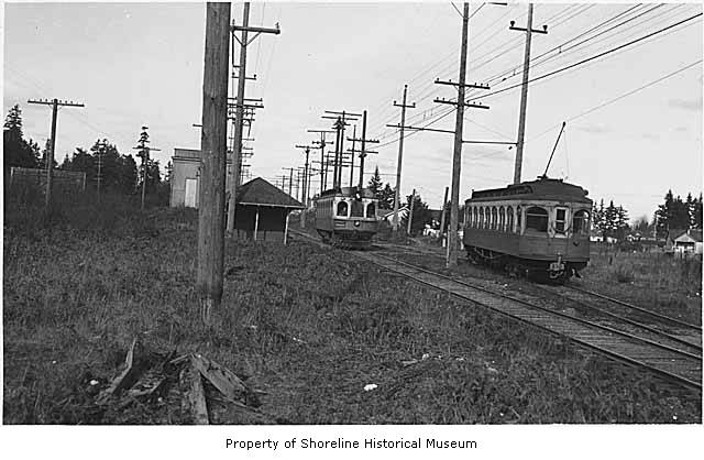 an old po of two trolleys near power lines