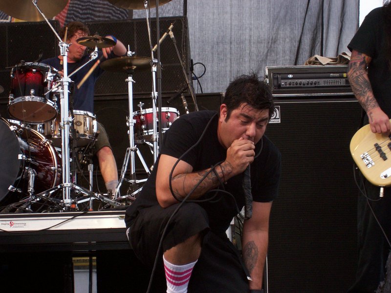 a man is playing an electronic guitar