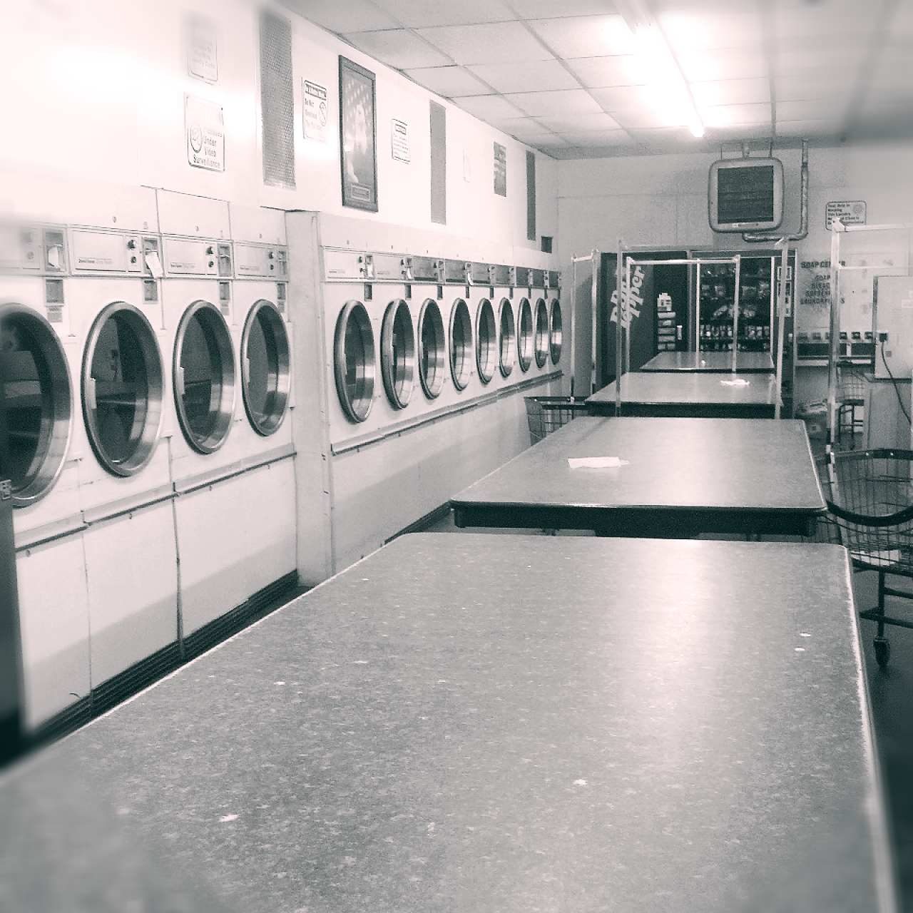 a very long line of washers and dryer machines