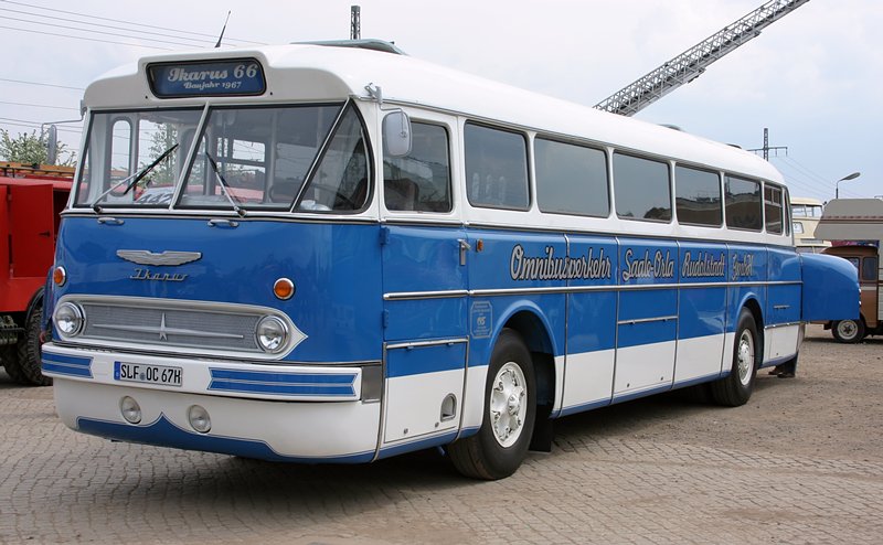 an older style bus parked in a lot