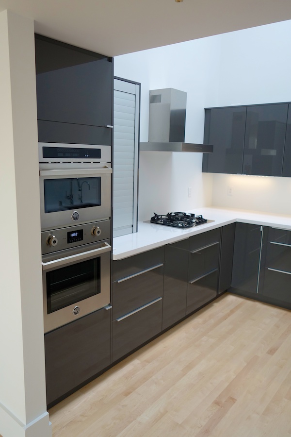 modern kitchen with black and stainless steel appliances