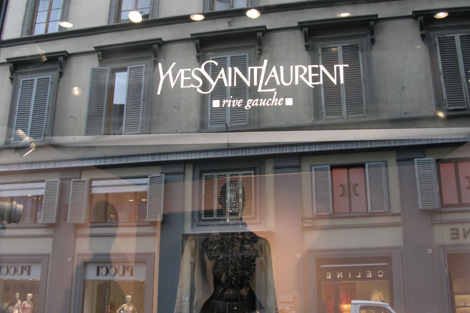 the front window of a women's clothing store with mannequins in the windows
