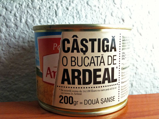 a can of artisan food is on a table