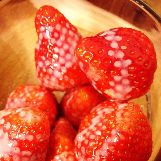 a bowl with some strawberries that are ready to be mixed