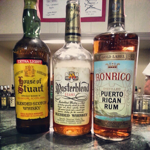three different types of alcohol bottles are on the counter