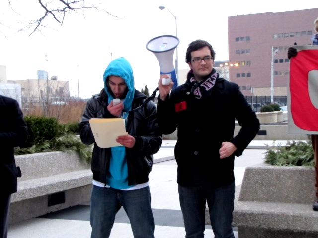 the man has his picture taken holding a megaphone