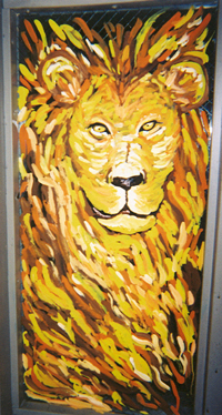 a lion painting in a restroom next to a door