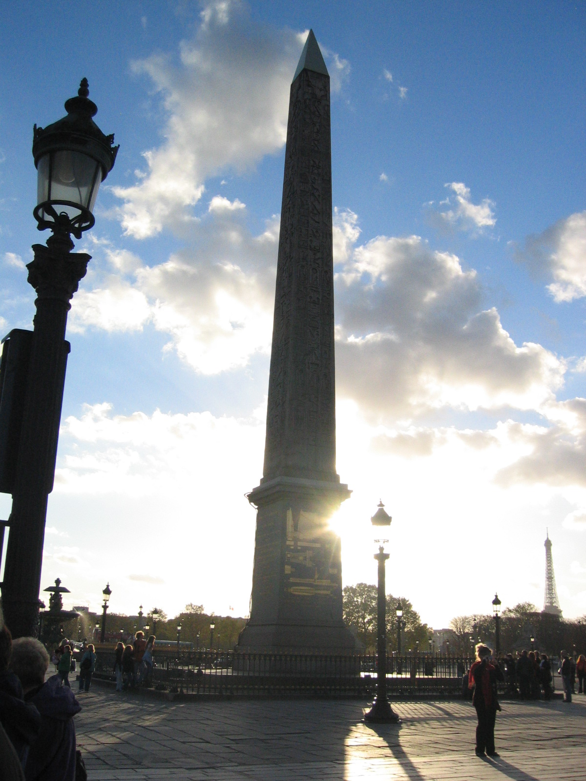 a po of a very tall statue that is sitting next to a lamppost