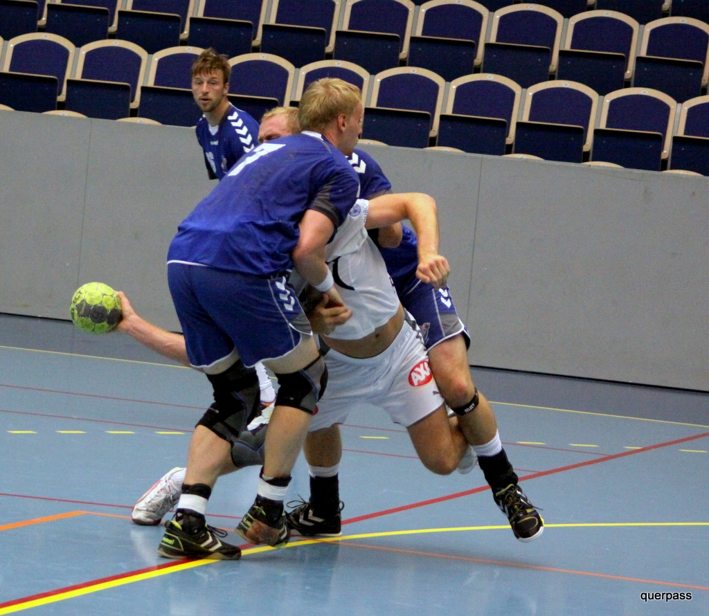 men on different teams in an indoor game