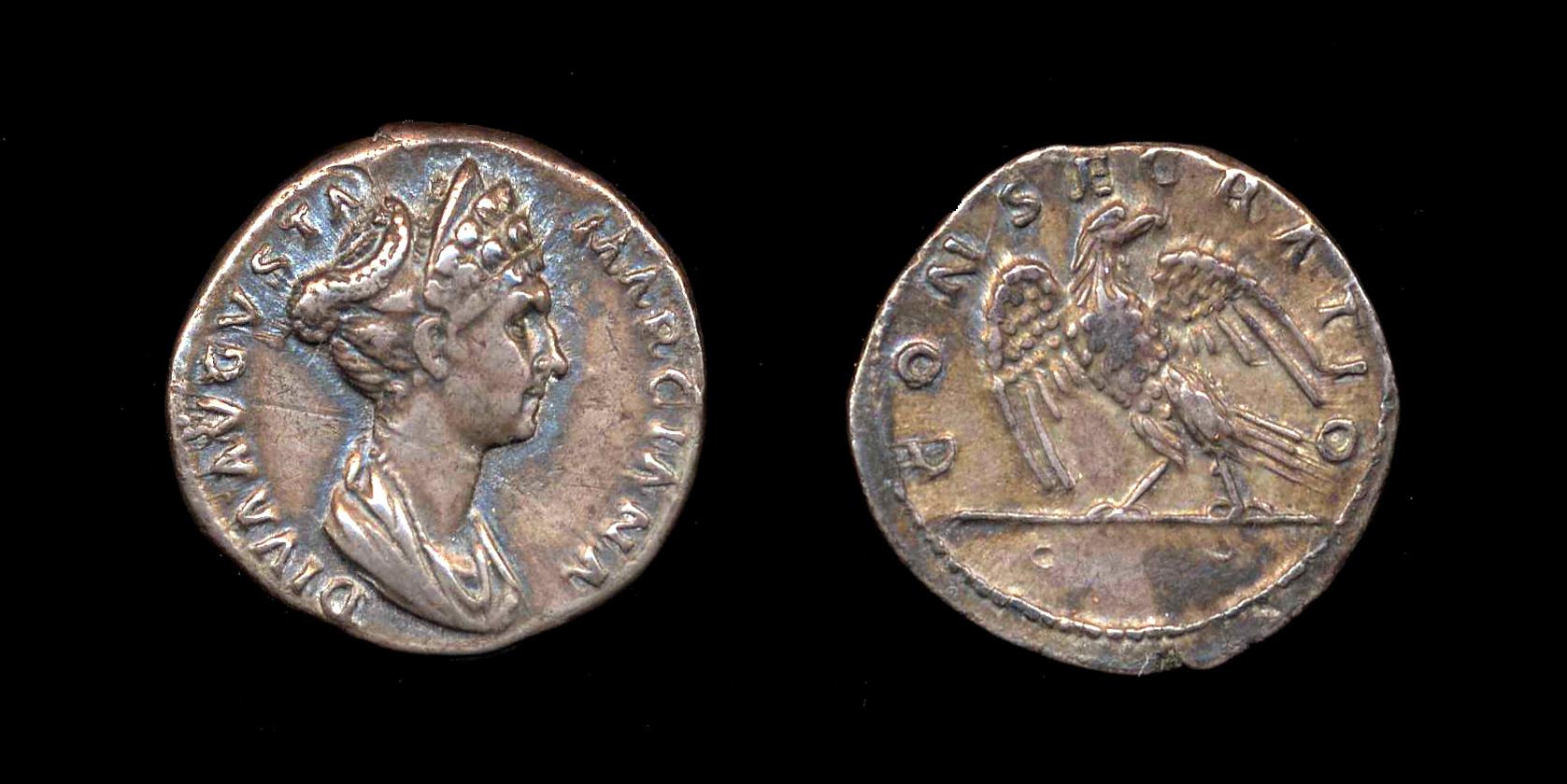 a roman silver coin with a woman holding a sword