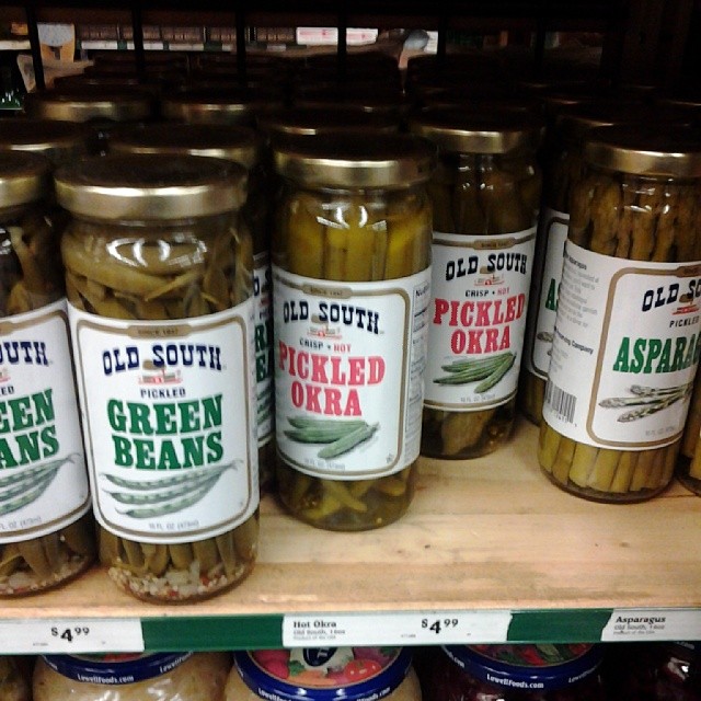canned pickled beans are displayed in the store