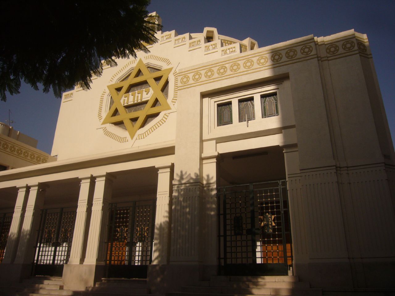 an old building with two pillars and a star of david on top