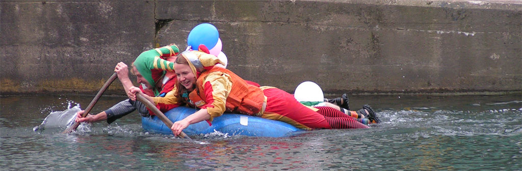 two people are in the water with one person on a raft