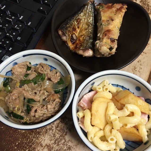 three bowls that have food in them on a desk