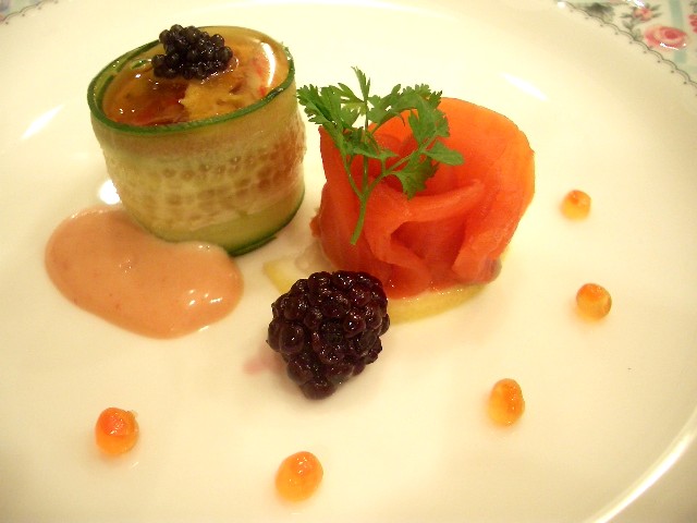 a small dish with fruits, sauce, and cavia