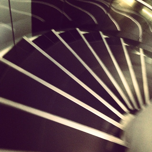 a close up view of a spiral metal wall