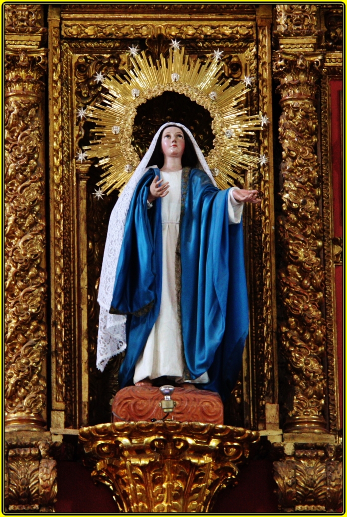 statue of mary mary of latter on altar