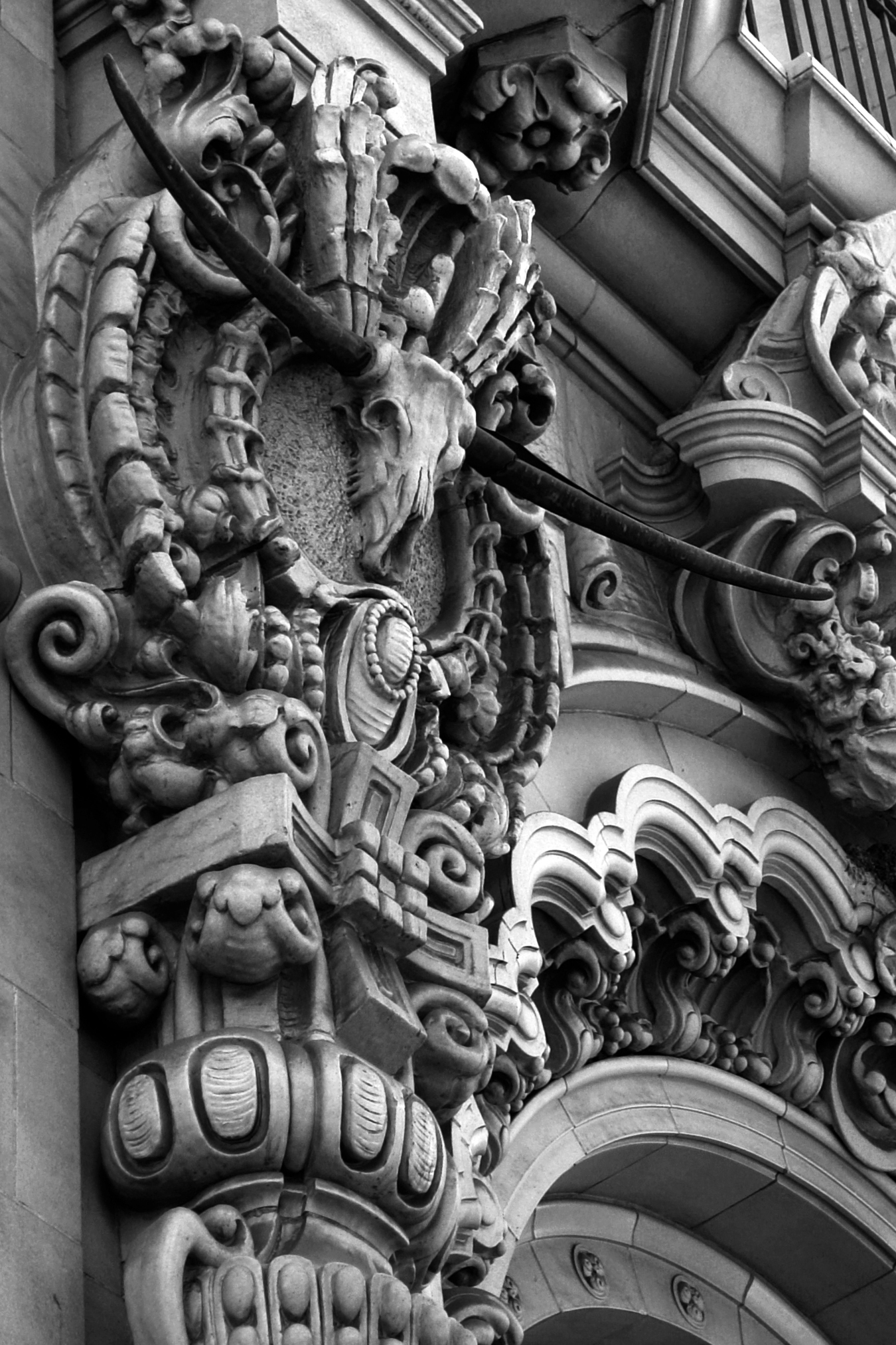 an elaborate architectural gargoyle and door on a building