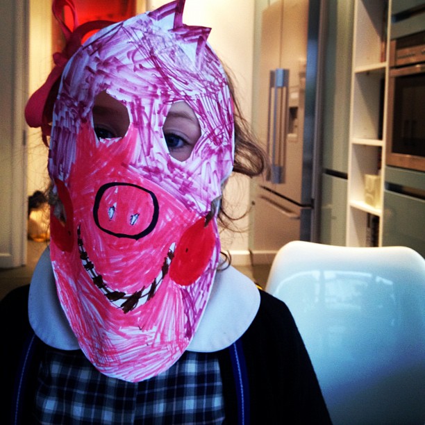 the  is wearing a pig mask
